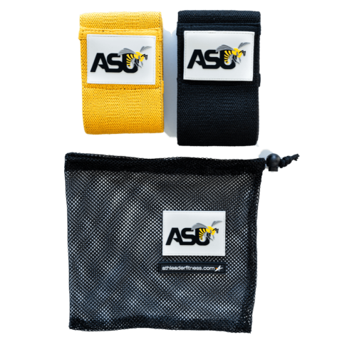 Two wrist wraps in yellow and black with a mesh storage bag, all featuring a branded logo.