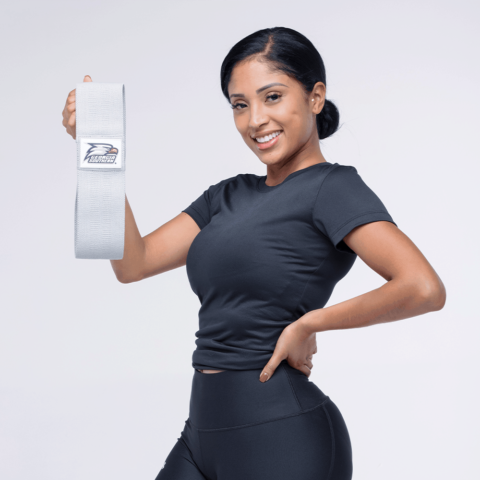Woman holding a white product with a logo against a light gray background