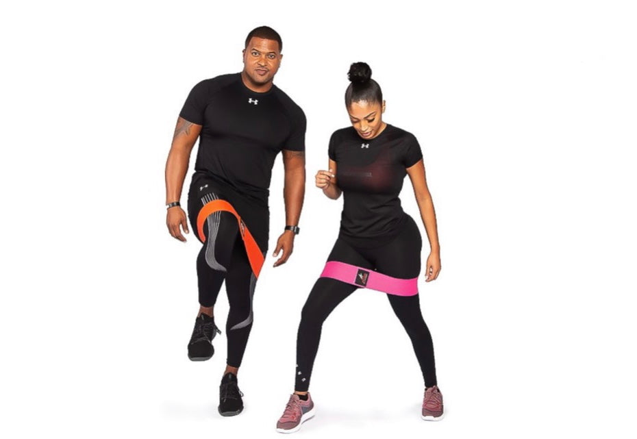 two persons exercise with band 